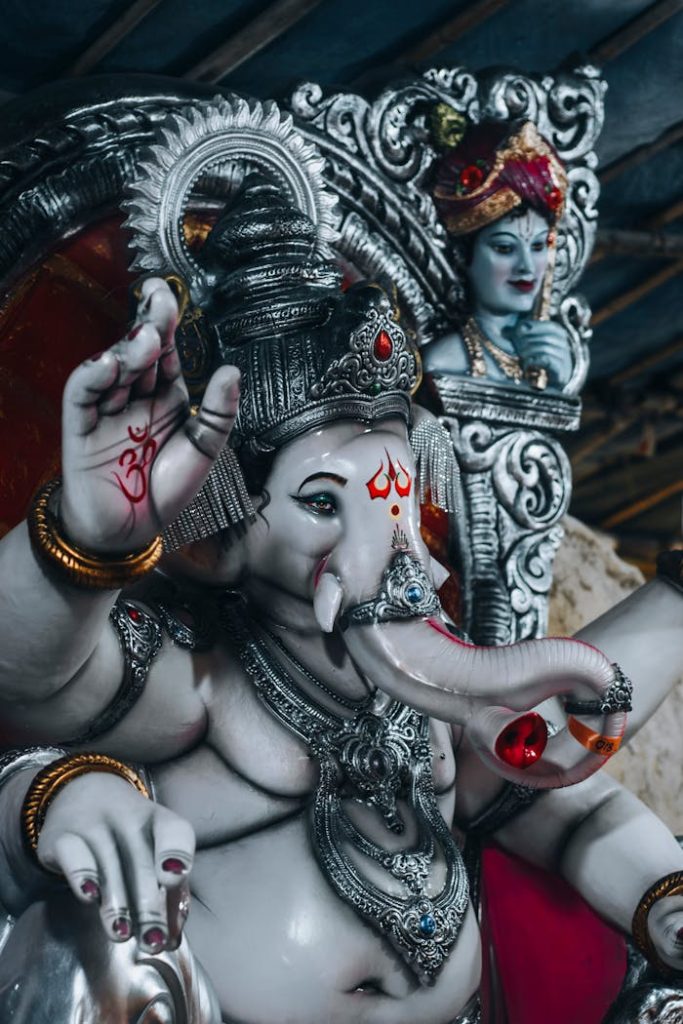 Hello world! Ornate sculptures of Ganesh and a Hindu deity, symbolizing spirituality and culture.